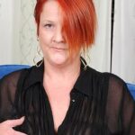 Chubby red mature slut playing with her pussy