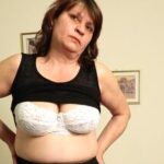 Horny mature slut masturbating on the couch